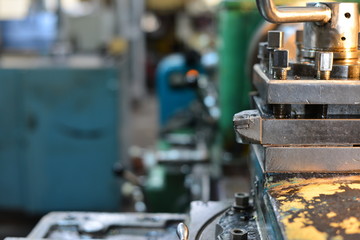 Professional machinist. Horizontal shot of a man operating lathe grinding machine metalworking industry concept copyspace