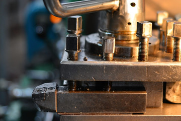 Professional machinist. Horizontal shot of a man operating lathe grinding machine metalworking industry concept copyspace