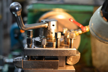 Professional machinist. Horizontal shot of a man operating lathe grinding machine metalworking industry concept copyspace