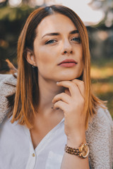 Beautiful young woman and on autumn day