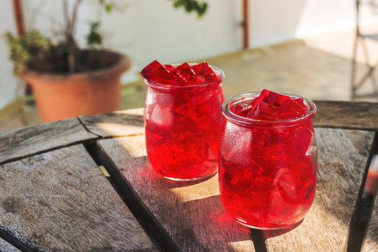 red jelly, cut into dice, inside two glasses of glass