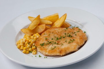 simple dish of Russian, Belarusian, Ukrainian cuisine on a white background French fries with meat and corn.