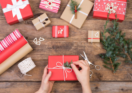 Packing Christmas Presents On Wooden Table, Top View