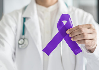 Hodgkin's lymphoma and testicular cancer awareness violet ribbon symbolic bow color on doctor’s...