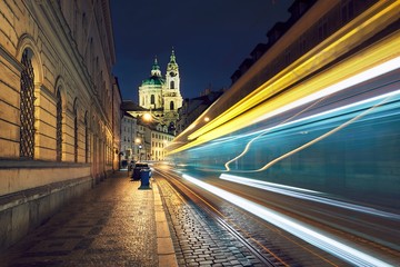 Fototapeta na wymiar Traffic on the ancient street in Prague