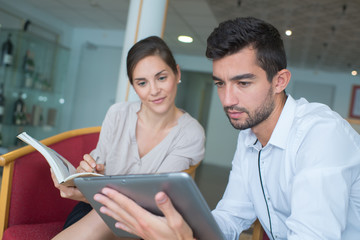 Man and woman looking at tablet screen