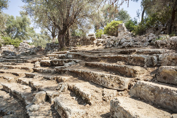 Fototapeta na wymiar Ruins of the antique greek theater, Kedrai, Sedir island, Gulf of Gokova, Aegean Sea, Turkey