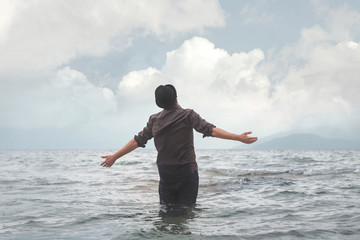 man walking in the water