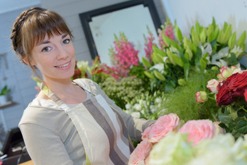 female florist create beautiful bouquet