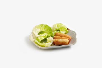 Vietnamese rolls with lettuce on white blackground
