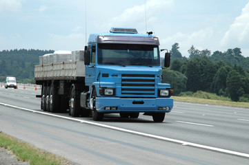 empty blue semi truck on mair road