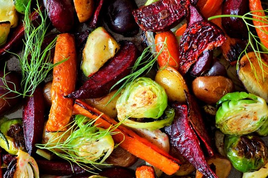 Full background of roasted colorful autumn vegetables, above view
