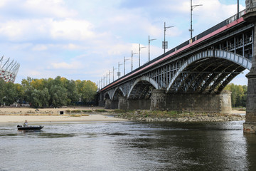 Fototapeta na wymiar Poniatowski bridge across the Vistula river in Warsaw