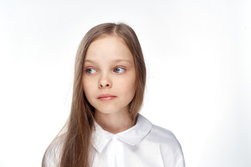 Fototapeta premium 1657280 little girl in a shirt on white isolated background, portrait