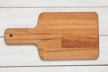 Wooden cutting board. View from above. Cooking. For your design.