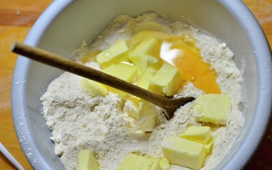 Kneading dough with hands on apple pie