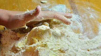 Kneading dough with hands on apple pie
