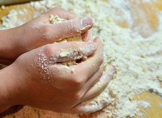 Kneading dough with hands on apple pie
