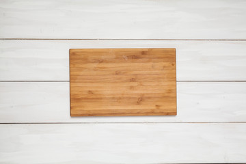 Wooden cutting board. View from above. Cooking. For your design.