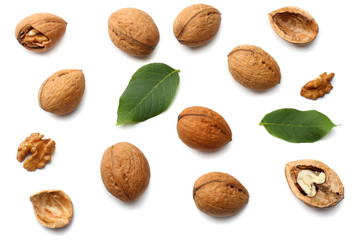 Green walnuts with leaves isolated on a white background Top view