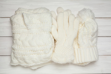 Female fashion winter accessory. Warm gloves. White. View from above.