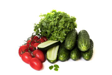 vegetables cucumbers and tomatoes on a white background