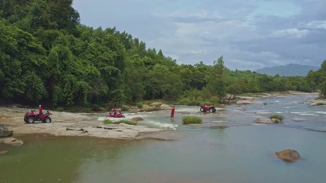 Tourists Drive Quadricycles across Deep River Part
