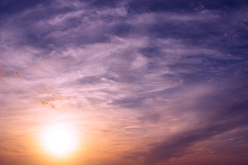 Obraz premium The colors of the sunset painted the clouds in different colors.