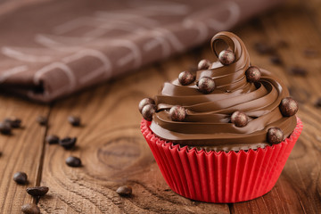 Homemade coffee and chocolate cupcake in red cup