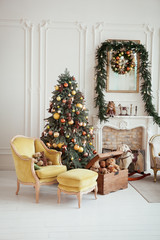 Beautiful Christmas interior. New year decoration. Living room with fireplace