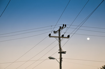 Old rope laying electric at sunset.