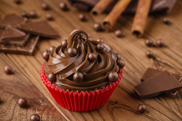 Homemade chocolate cupcake with chocolate chips in red cup