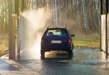 Obraz na płótnie Canvas Car wash car under high pressure