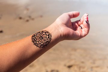 hand with mandala pattern tattoo henna mehendi