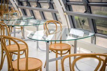High-tech interior bar cafeteria - tables and chairs in a cafe. The modern design of the restaurant.
