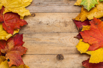 Naklejka na ściany i meble Yellow autumn leaves. Season. Wooden table. For your design.