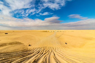 Fototapeta na wymiar View from top of dune toward Star Wars Mos Espa movie set