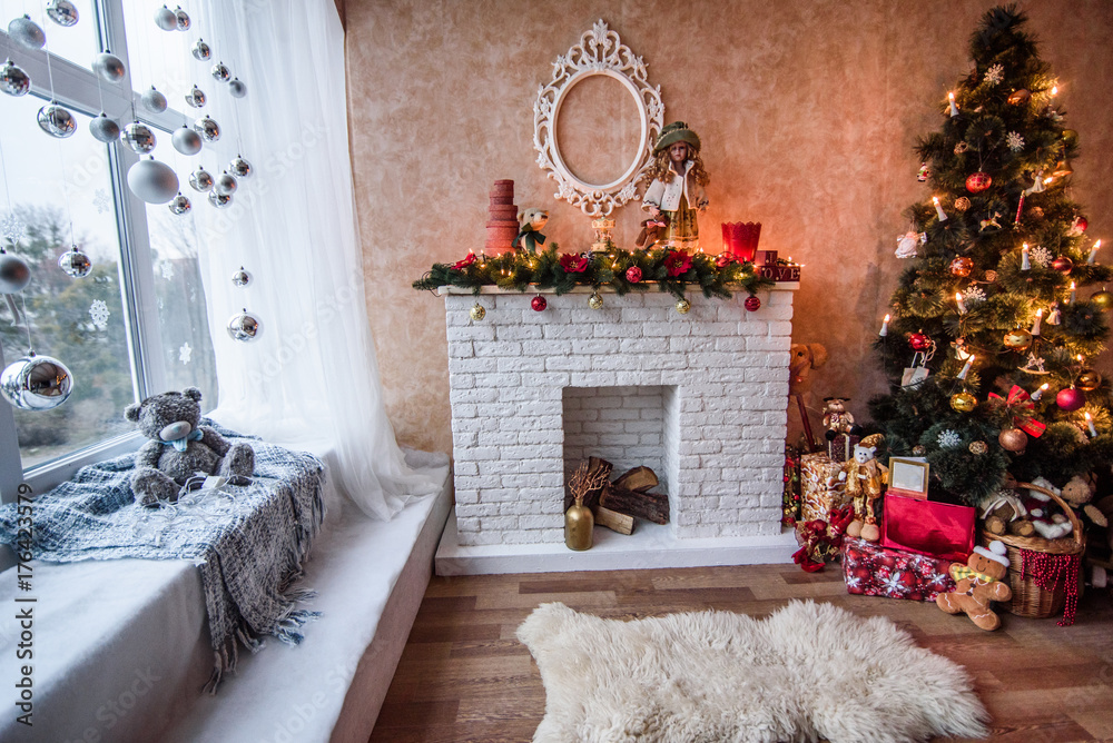 Wall mural A beautiful living room decorated for Christmas with Christmas tree and presents under it