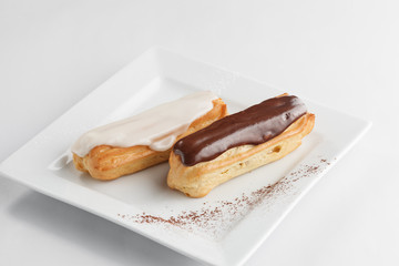Eclairs on a white plate