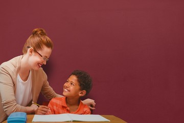Composite image of teacher helping pupil