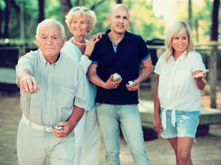 Happy family playing petanque in outdoor