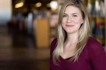 Fun natural headshot portrait of a young female college student positive joyful and enthusiastic