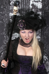 pretty blonde woman wearing historical purple black long dress