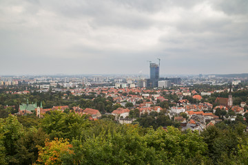 Fototapeta Oliwa district and beyond in Gdansk, Poland, viewed from above on a cloudy day. Copy space. obraz