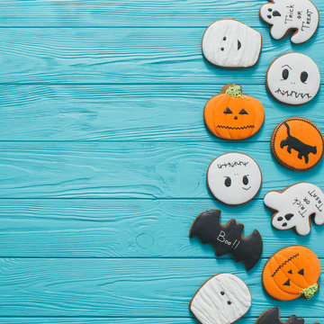 Fresh Halloween Gingerbread Cookies On Blue Wooden Table.