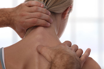 Chiropractic back adjustment. Osteopathy, Acupressure, Sport Injury Rehabilitation concept. Female...
