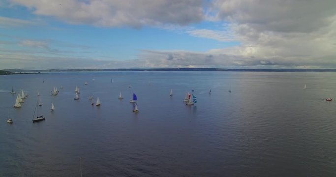 [Aerial] Slow flight over sailboats large lake vista 2