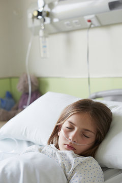 Patient child in a hospital bed sleeping
