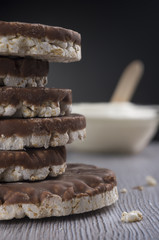 Rice biscuits and crackers in chocolate on the table