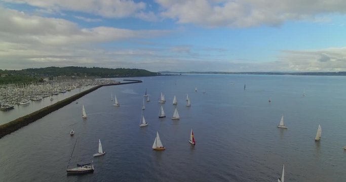 [Aerial] Pan over sailboats and marina